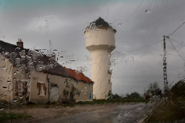 rainy day, travel, city, rain drops on car window, photo by Christophe Jacrot.