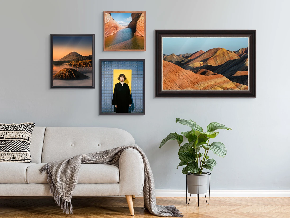 Several different motifs framed in a Gallery Frame on a wall in a living room.