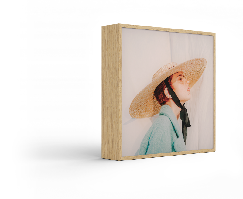 Standing ArtBox with frame color Natural oak against a white background.