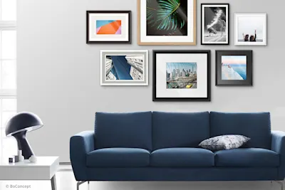 Couch in front of Passepartouts Images.