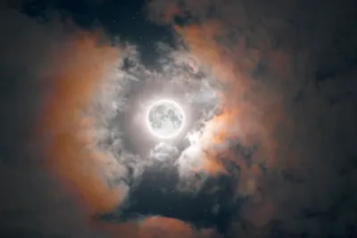 moon photography with clouds by Darya Kawa Mirza.