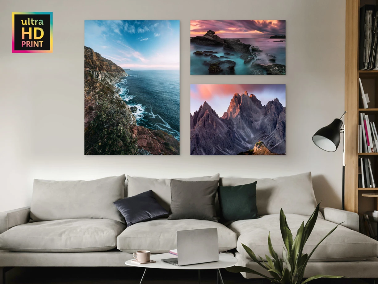 Several different motifs on a ultraHD Photo Print On Aluminum Backing hang on a wall in a living room.