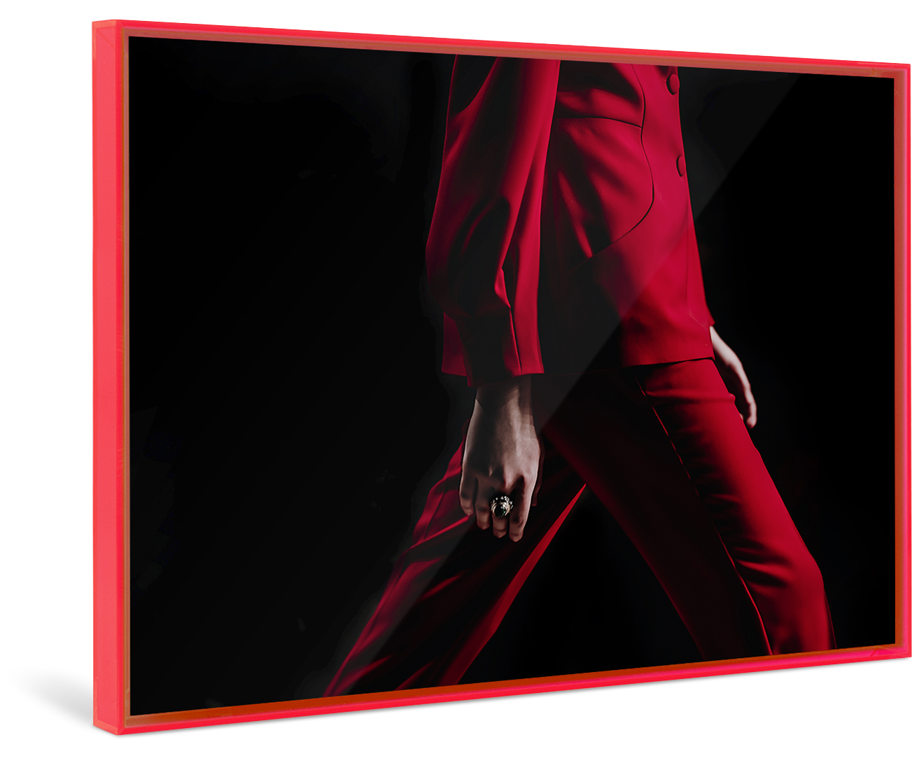 A person in a red suit walks in front of a black background framed in a red Pop Art Frame.