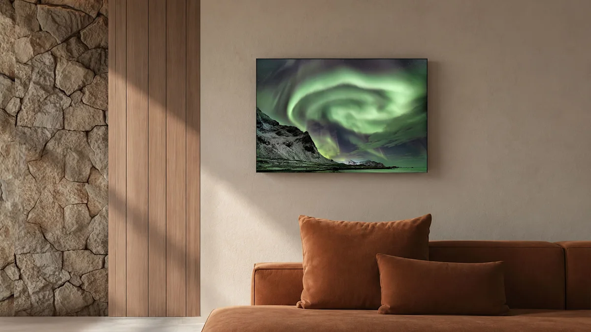 A large print on the wall displaying swirling green northern lights above mountains, above a brown sofa in a modern living room.