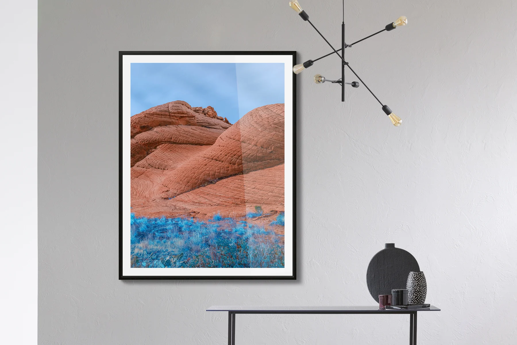 Red sandstone formations with fluorescent blue grass elements.