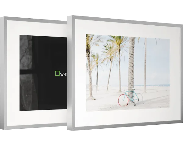 The picture shows two magnet frames. One frame has a fine art print in it. The other frame has no print.