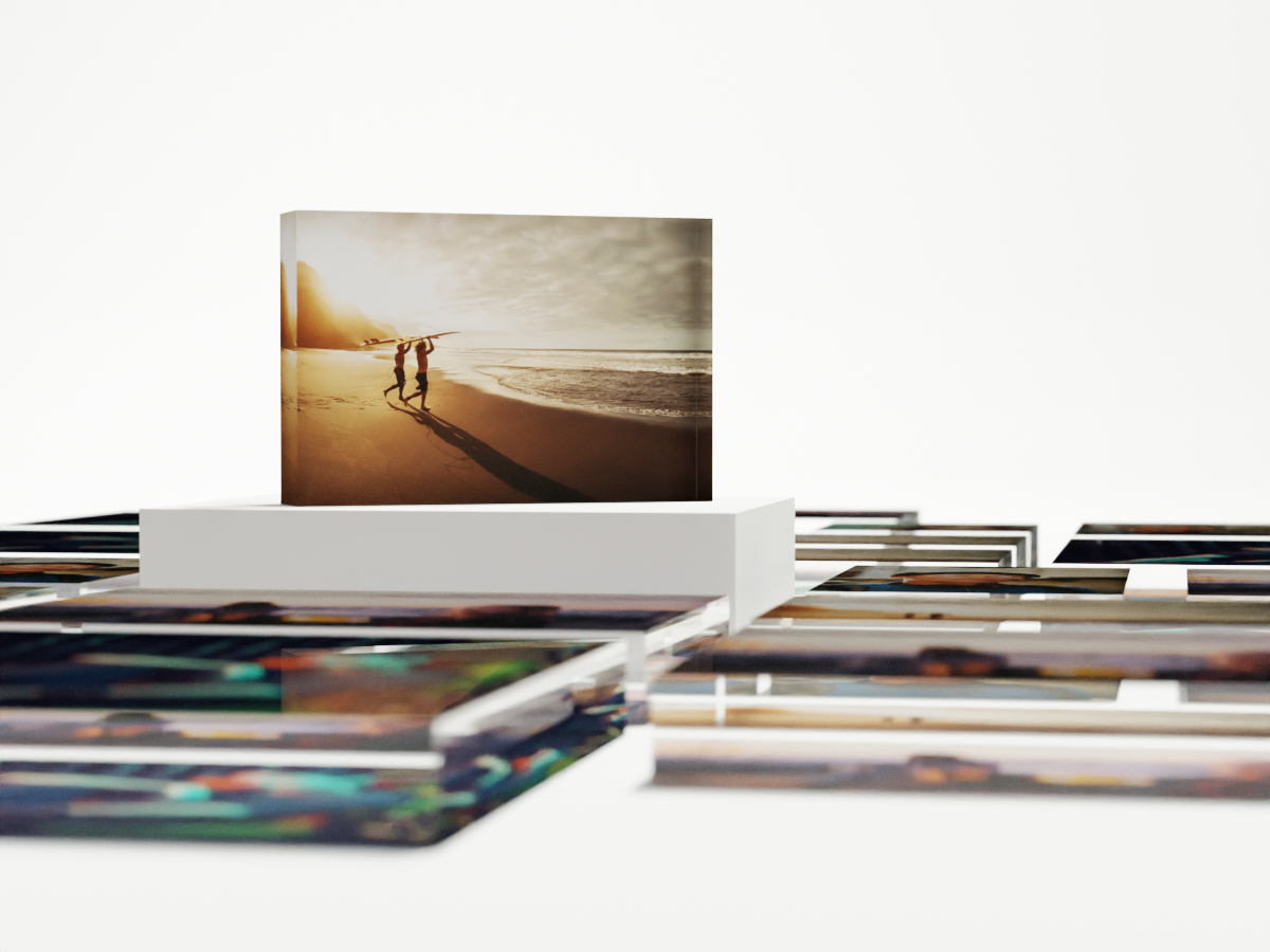 several acrylic photo block lying around a standing acrylic photo block in the middle.