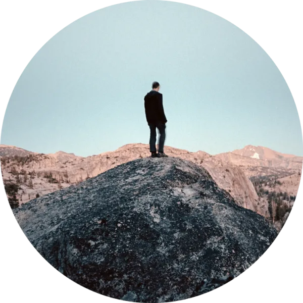 Self-portrait of Cody Cobb standing on a rock formation.