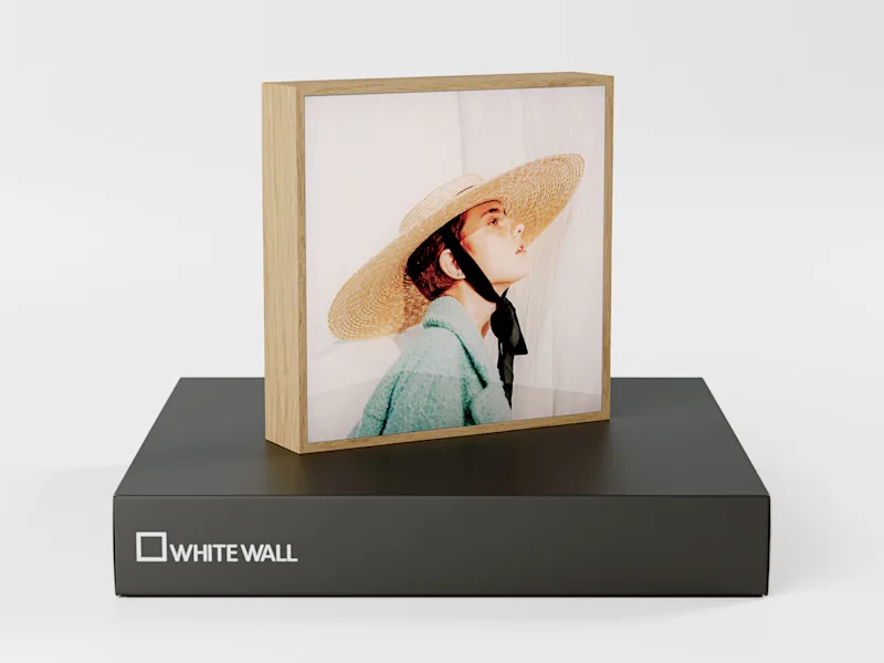 ArtBox on a closed gift box with the portrait of a woman wearing a straw hat.