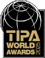 Logo TIPA Banner 2024 TIPA World Awards 2025 logo with golden lettering and stylized globe.