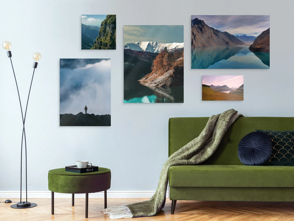 Several different motifs on a Photo Print On Aluminum Backing hang on a wall in a living room.