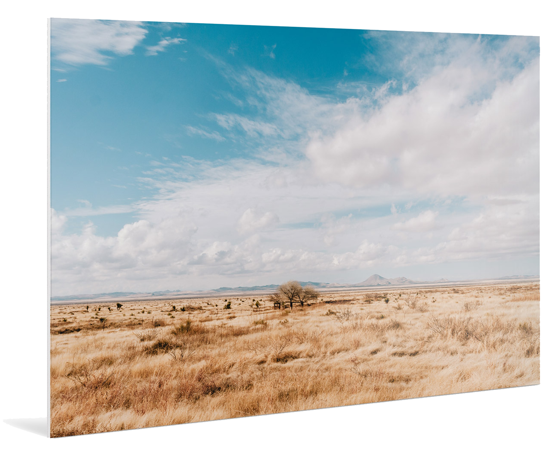 Clouds drifting over a parched landscape with mountains in the background, printed on a Direct Print On Forex.