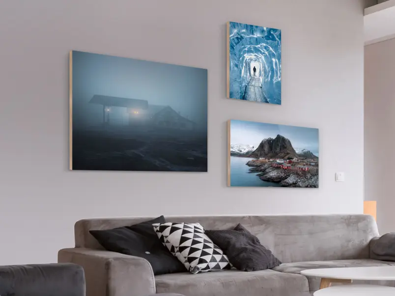 Several different motifs on Original Photo Prints On Wood on a wall in a living room.