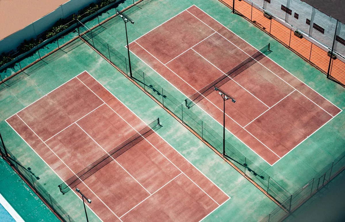 aerial shot of two tennis courts.