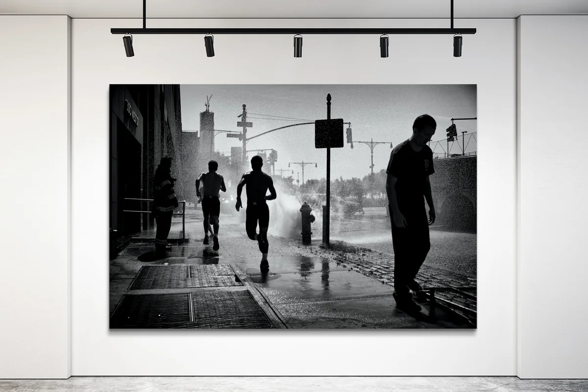 Kids playing with water in the streets of new york, only silhouette.