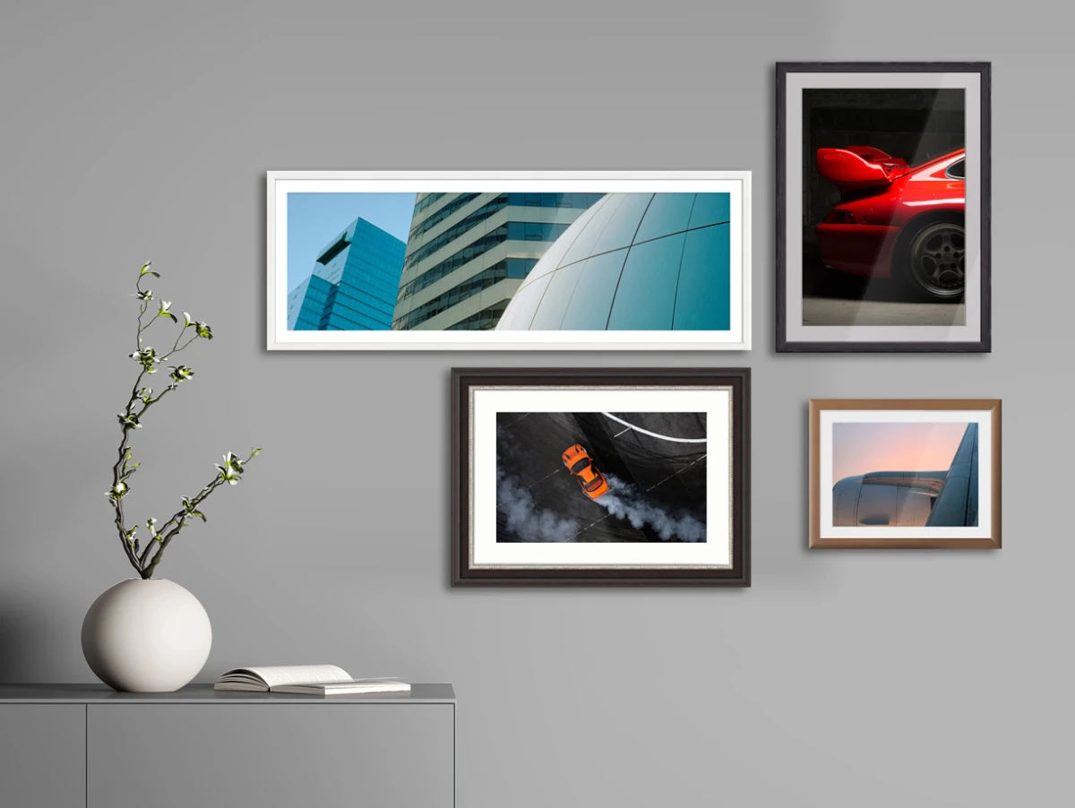 several LightJet prints on Fujiflex High Gloss paper in frames hanging on a wall.