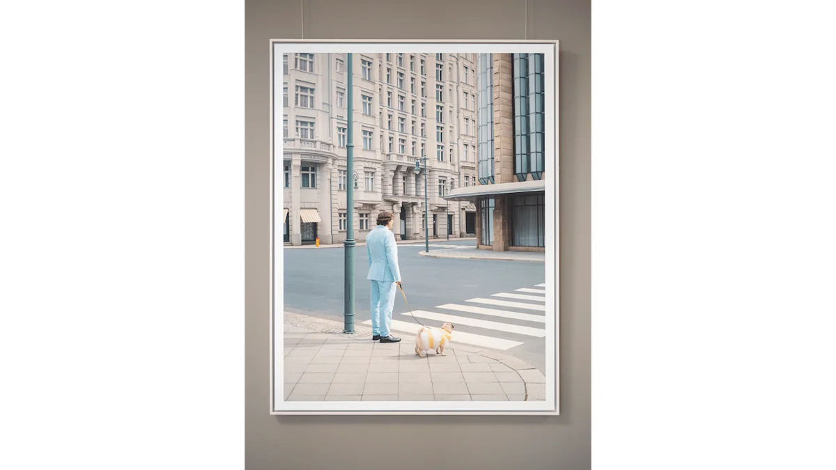 A framed photo on a gallery wall showing a man in a light blue suit walking a small dog at a city crosswalk.