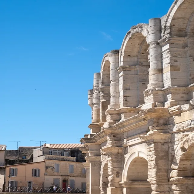 roman amphitheatre with blue sky in the background