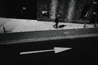 Old man walking down the street.