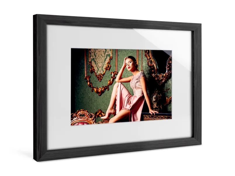 A woman has her portrait taken on a chest of drawers in a Solid Wood Frame With Passe-Partout.