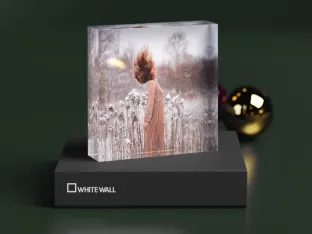 acrylic photo block standing on its gift box with winter motif.