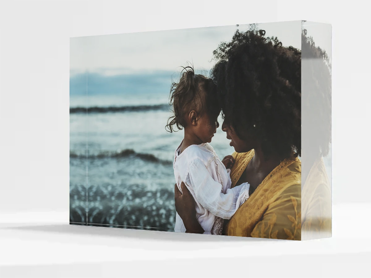 mother holding her forehead against her daughter's as an Acrylic Photo Block - photo by Anastasia Prodous.