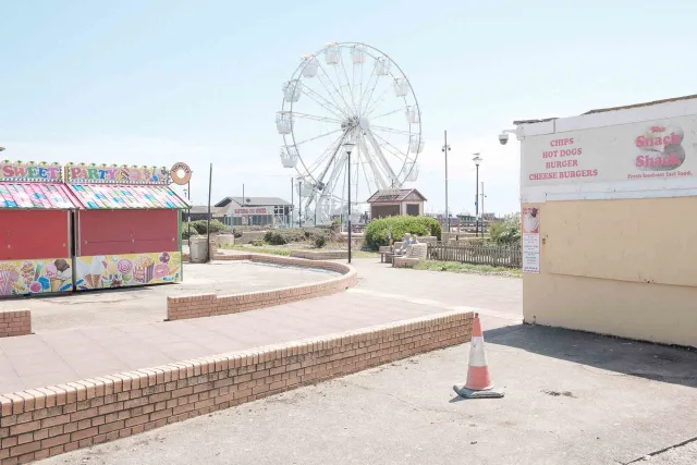 Abandoned amusement park in soft hues.