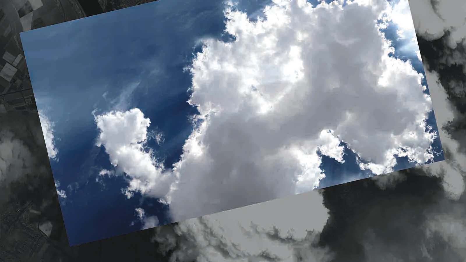 Clouds against a deep blue sky, oblique perspective.