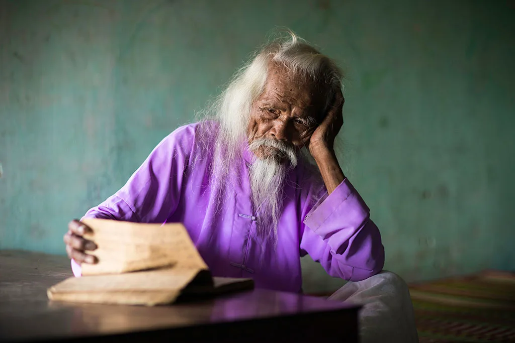 elderly man reading.