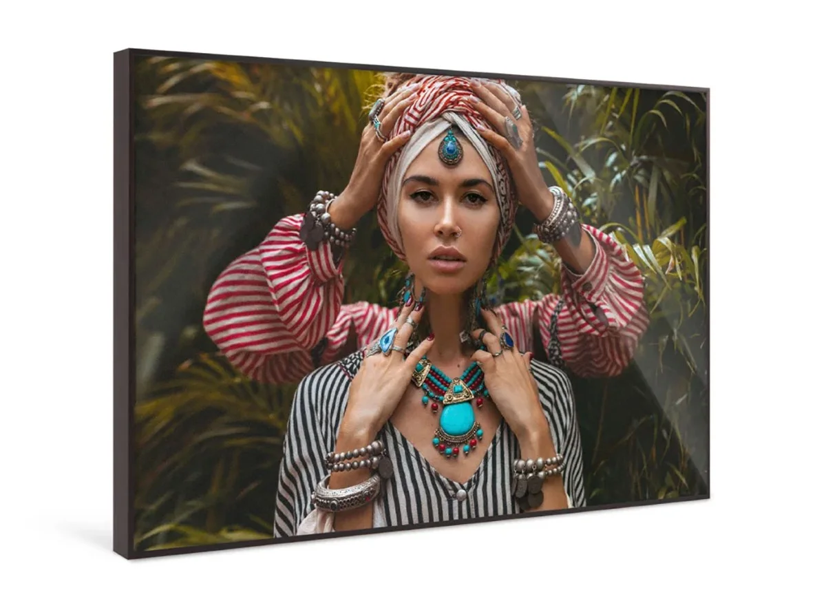 Four hands of two people wearing jewelry touch the head and neck of a person wearing a turquoise necklace.