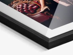 Close up of a woman has her portrait taken on a chest of drawers in a Solid Wood Frame With Passe-Partout.