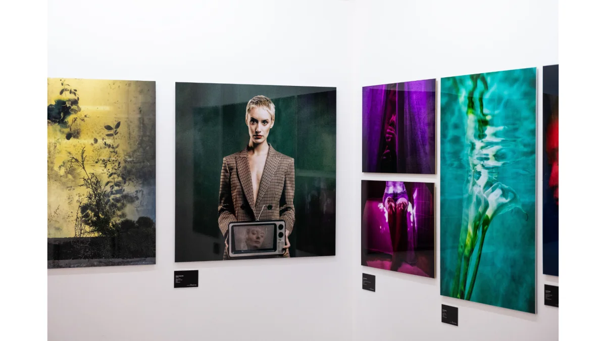 four prints exhibited on a white wall