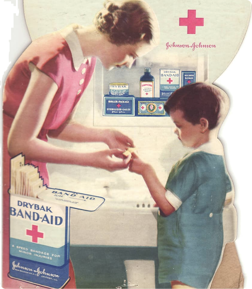 Woman putting a waterproof BAND-AID® Brand DryBak on boy