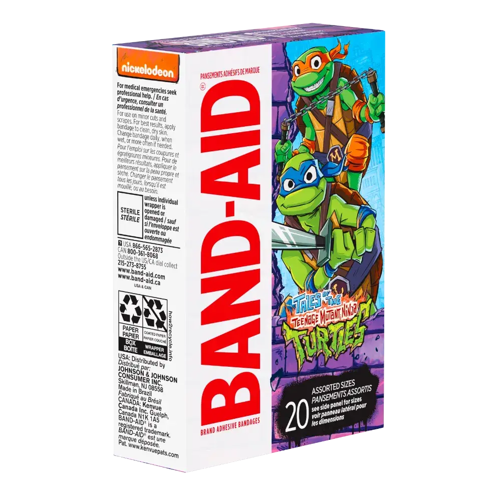 A box of Band-Aid brand adhesive bandages featuring Teenage Mutant Ninja Turtles artwork. The box is purple and features the TMNT characters prominently. The text indicates the bandages are assorted sizes and sterile. The Nickelodeon logo is also visible.