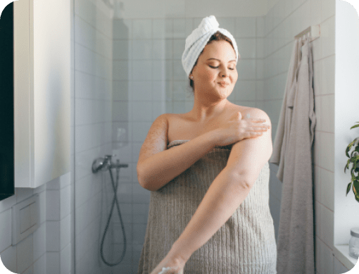 Woman practicing self after taking a shower