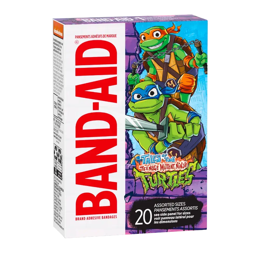 Imagine a box of Band-Aid brand adhesive bandages in vibrant purple, featuring Leonardo and Michelangelo from the Teenage Mutant Ninja Turtles. The iconic "BAND-AID" logo is in red, and it includes a collection of 20 assorted sizes, ready for action!