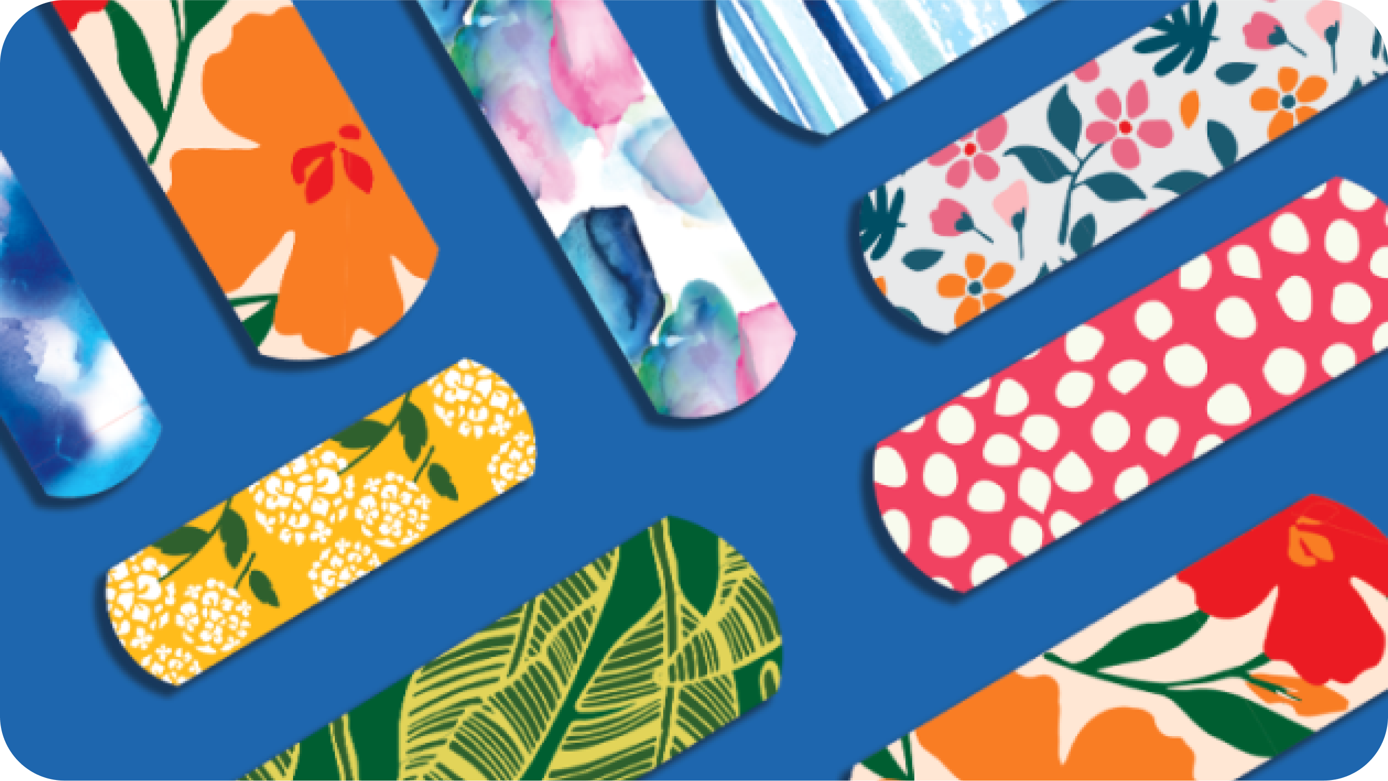 Assortment of BAND-AID® Brand limited-edition collection of cute & fun bandages laid out on a blue background