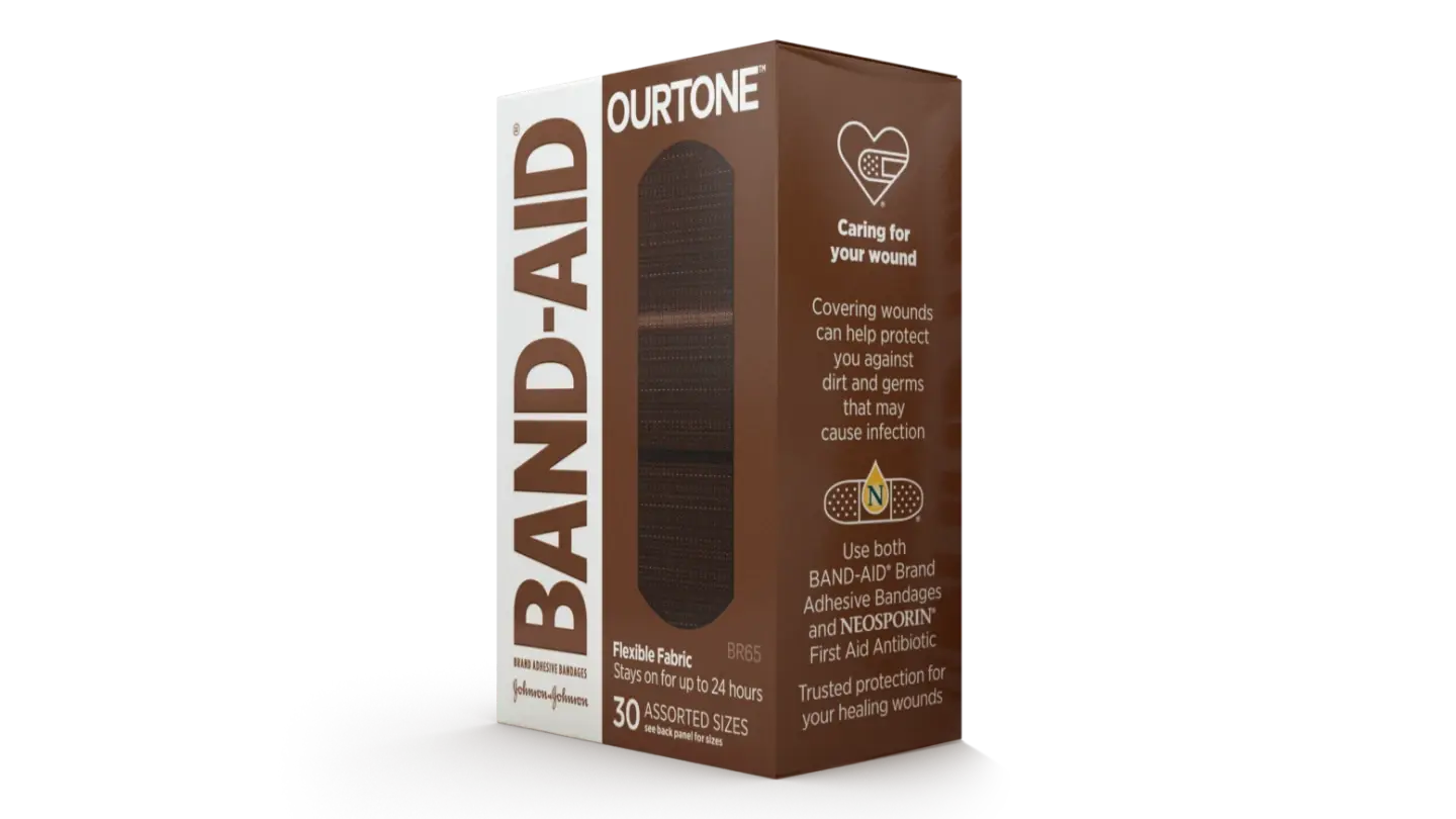 Band-Aid OURTONE flexible fabric bandages box with 30 assorted sizes, designed for wound care. The box highlights the product's ability to cover wounds, protect against dirt and germs, and offers up to 24-hour protection.