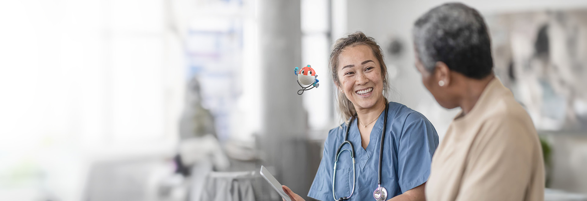 smiling healthcare worker talking to a patient