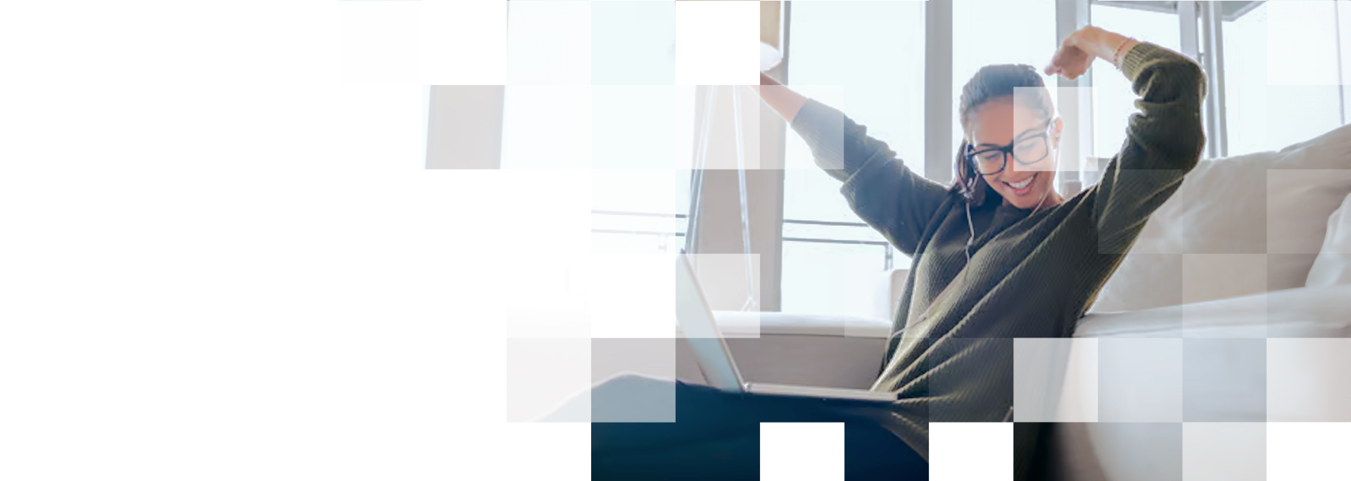 woman on couch celebrating