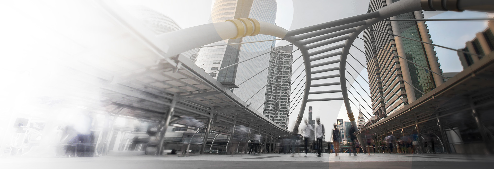 people walking along a bridge