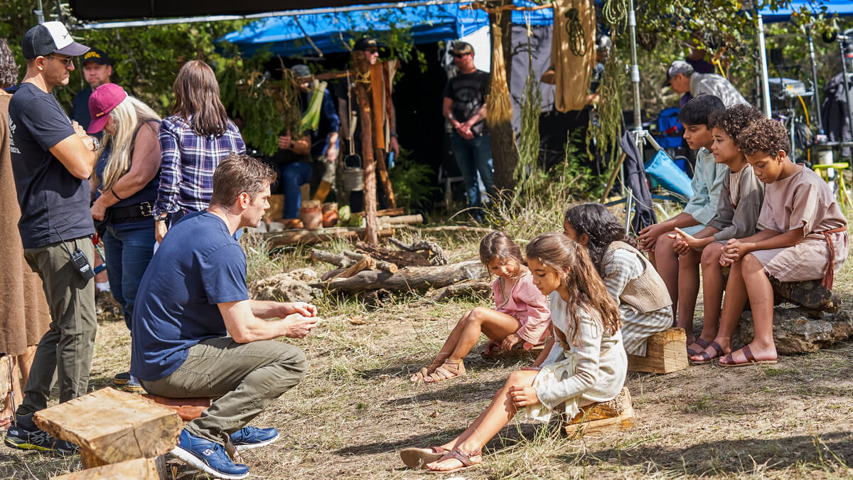 Dallas Jenkins directs children on the set of the Chosen