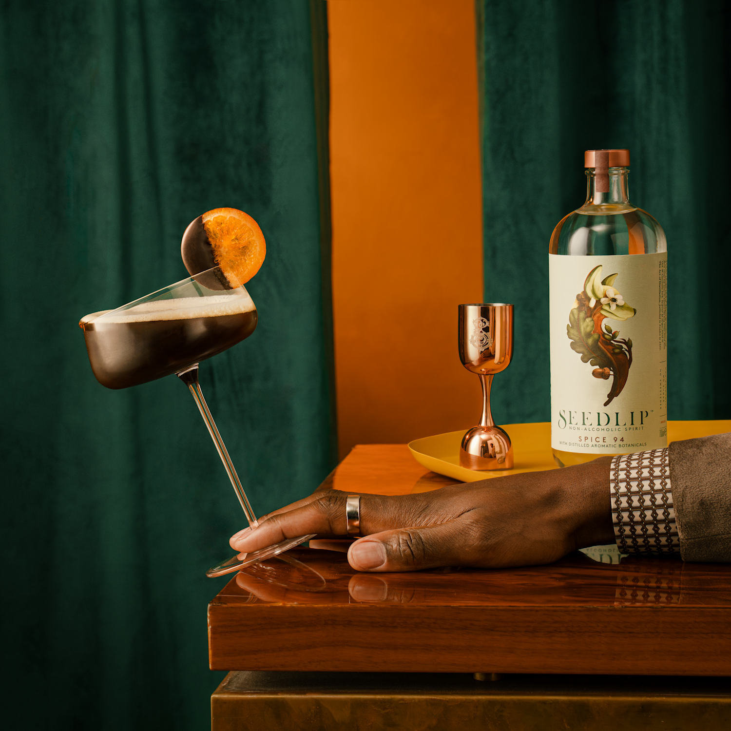 Seedlip spice espresso martini next to a bottle of Seedlip Spice 94