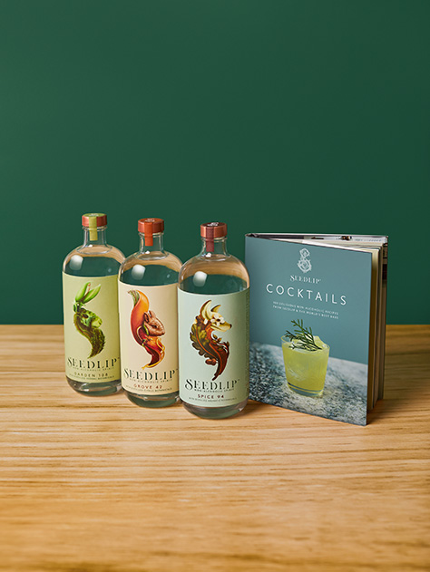 Collection of Seedlip Grove, Spice, Garden non alcoholic products alongside the Seedlip Cocktails recipe book