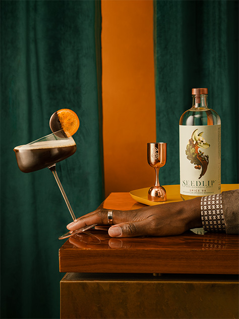 A bottle of Seedlip  Spice 94 on a wooden table