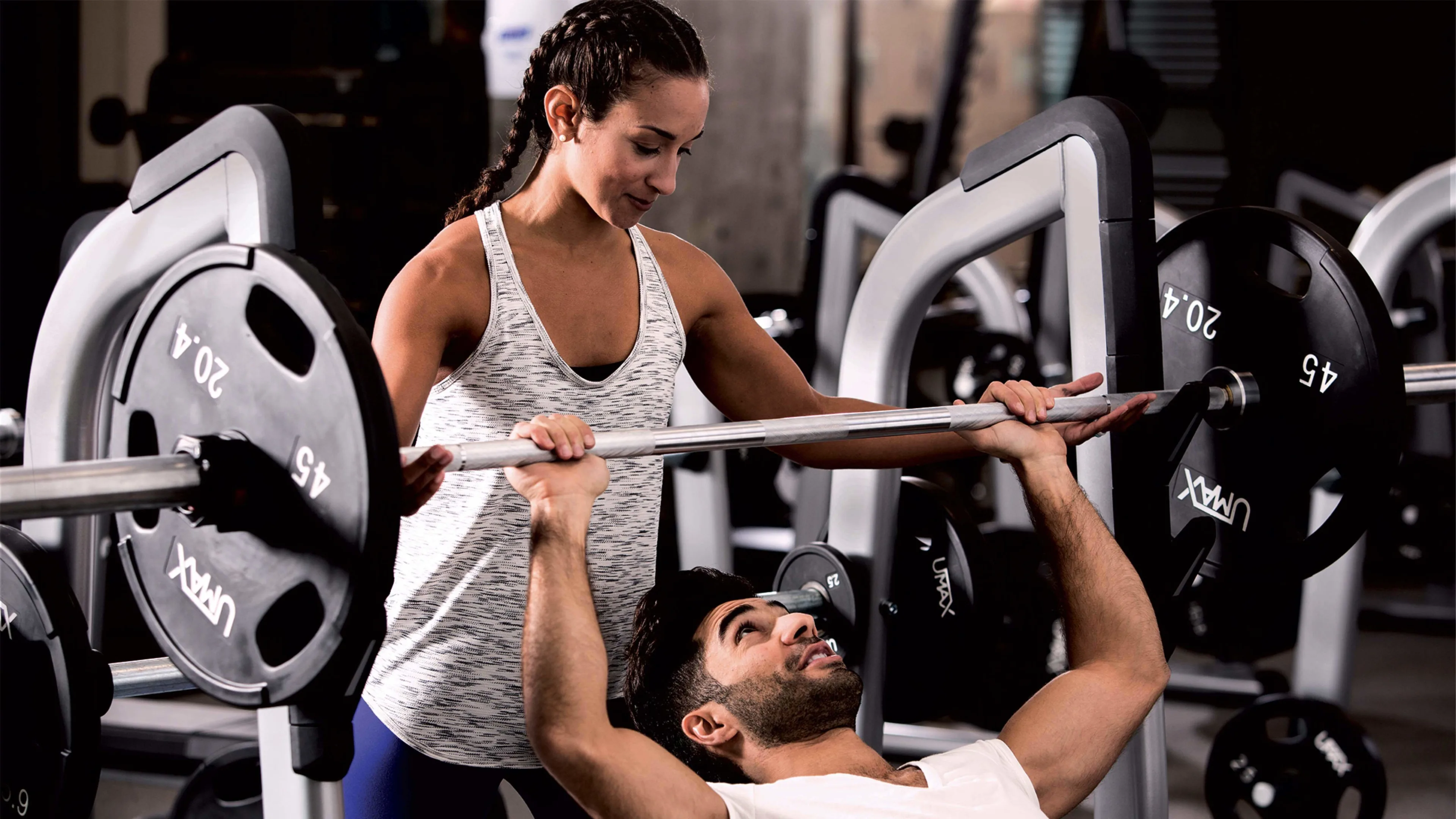 Gym members using Precor strength equipment