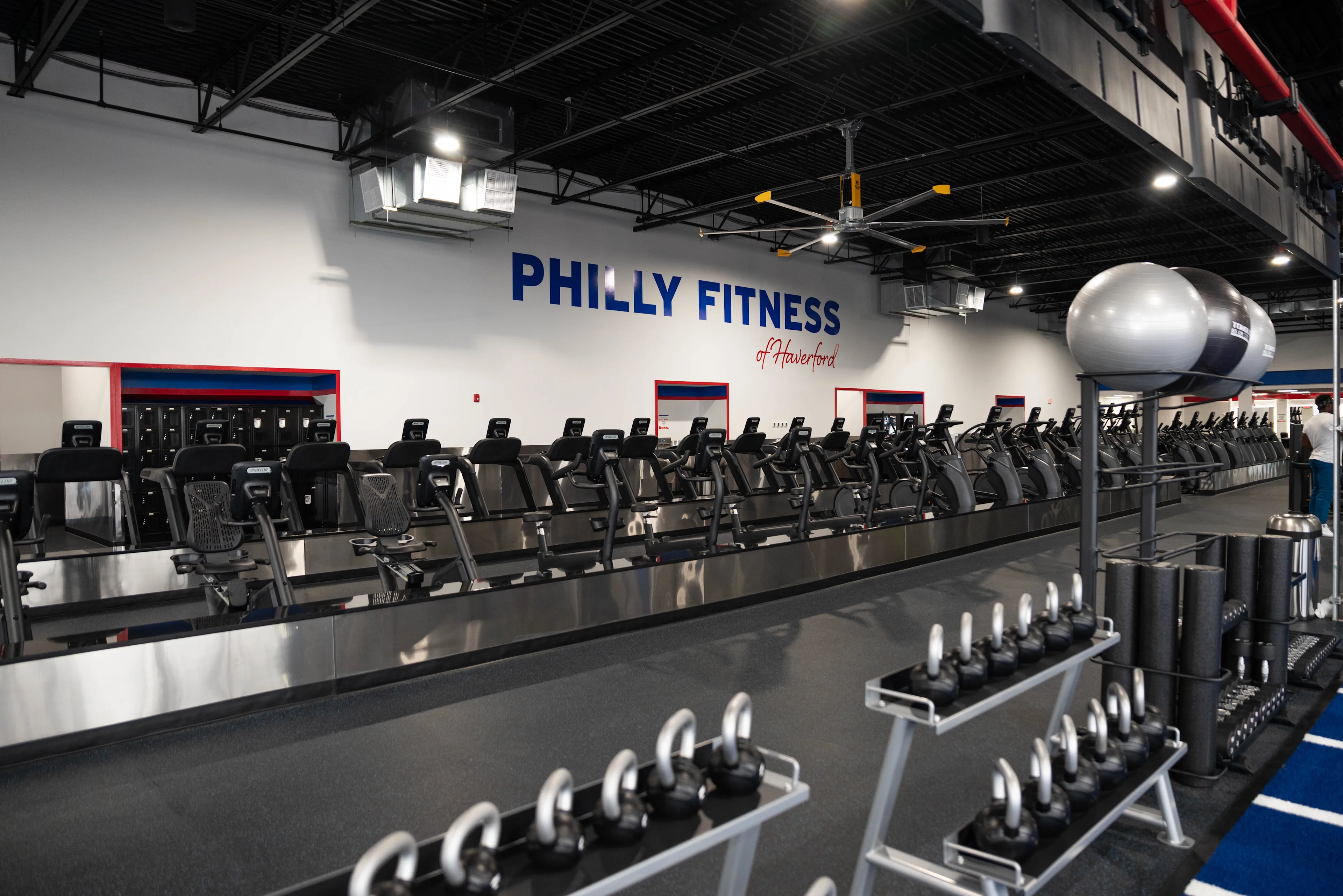 Philly Fitness Interior Cardio Lineup and Logo