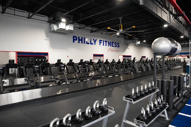Philly Fitness Interior Cardio Lineup and Logo