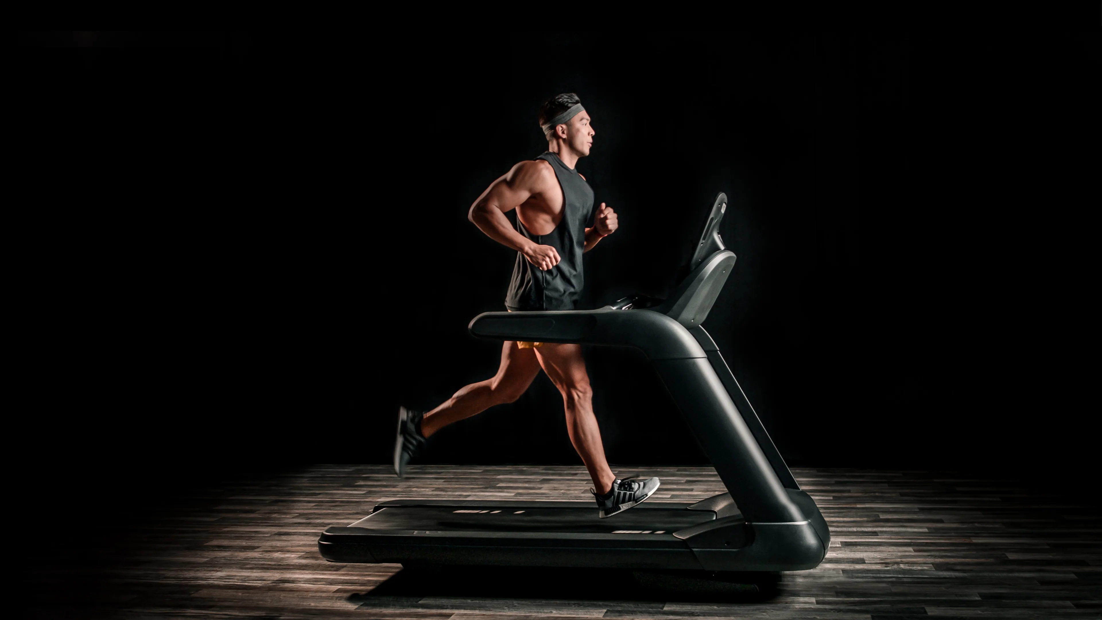 Exerciser running on a Precor treadmill (TRM)