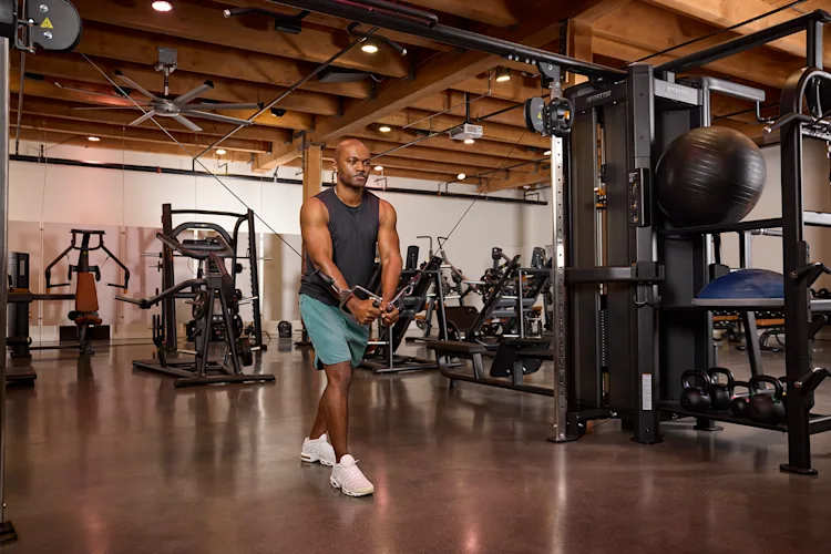 Precor_Facility_Strength_RMS_Person_Working_Out_Cable_Cross_Over.png